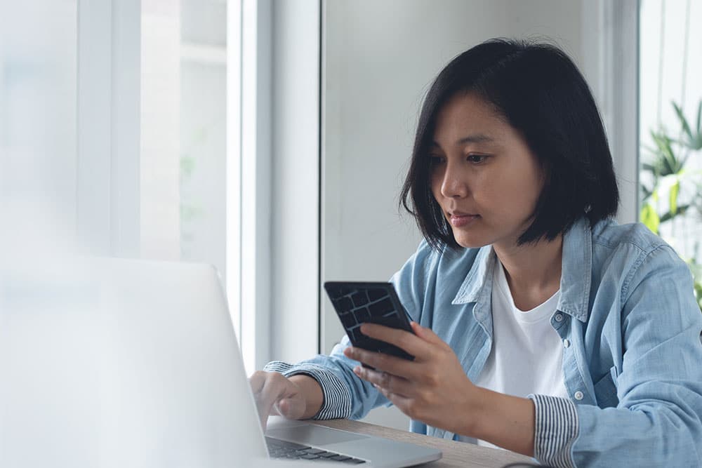 Managing-debt Female looking online to help find support for debt