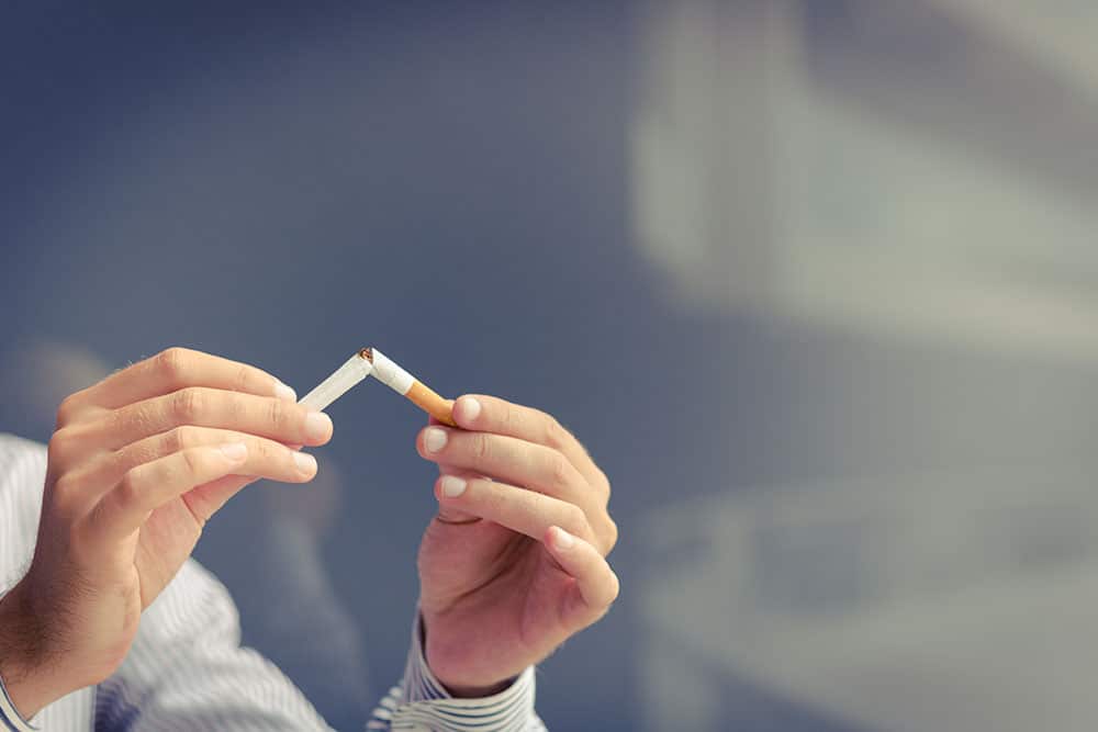 Person managing to control their addiction to smoking