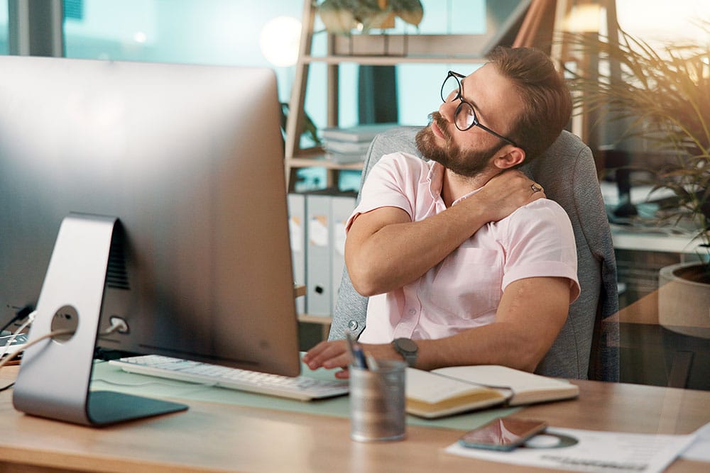 Person struggling with MSK issues at work