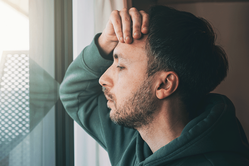 WPW-Suicide-Article_05.24 Man staring out the window