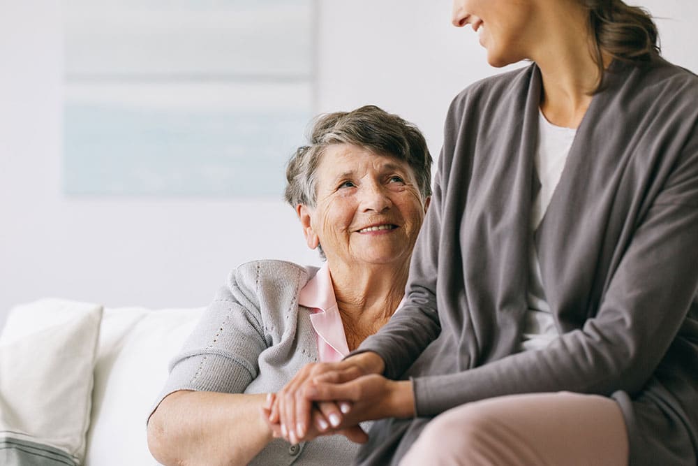 Person holding their mothers hand