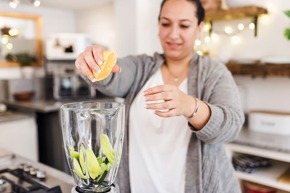 Weight-management-02.24 Female making healthy drink to help manage weight