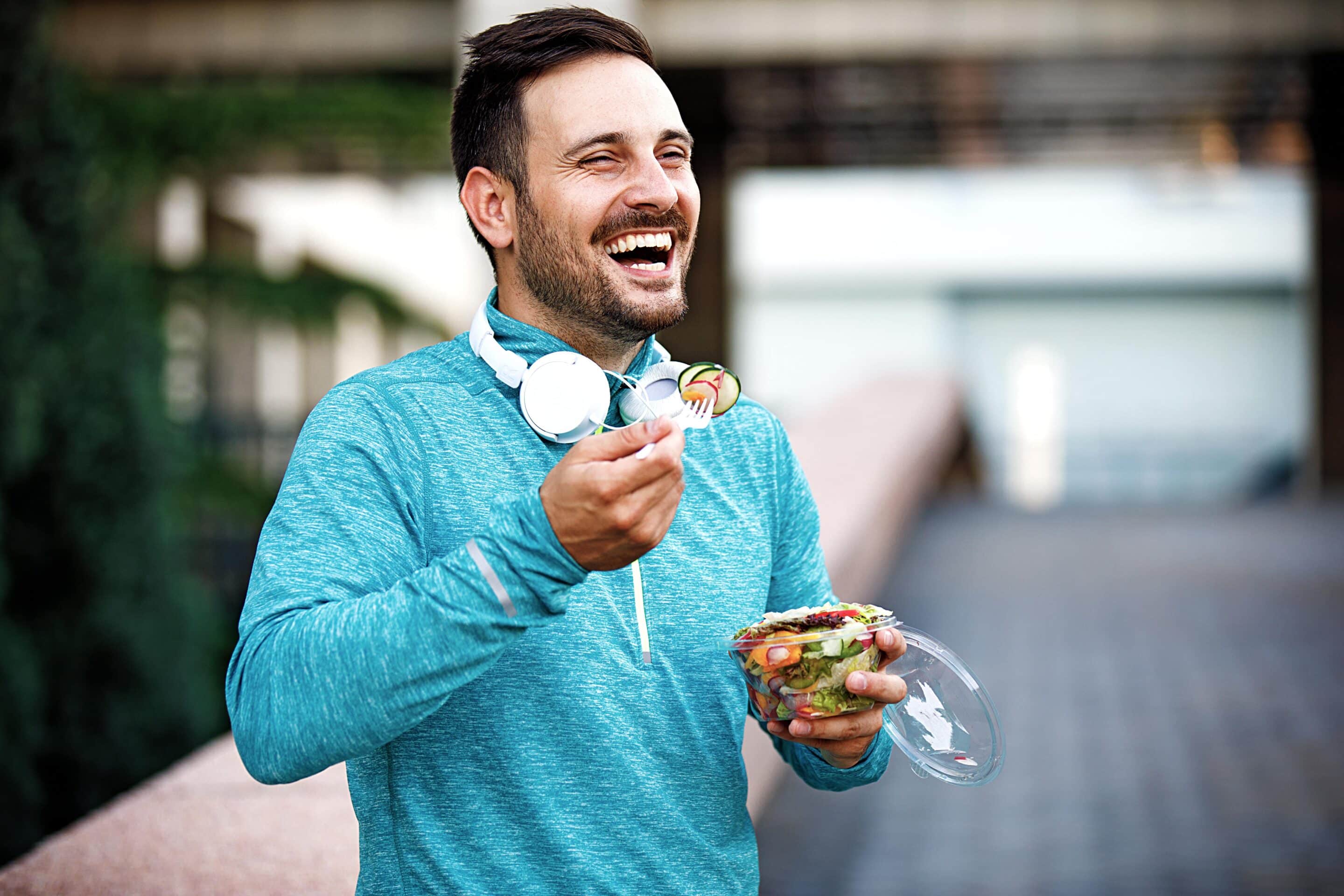Man getting some fresh air while eating healthy lunch