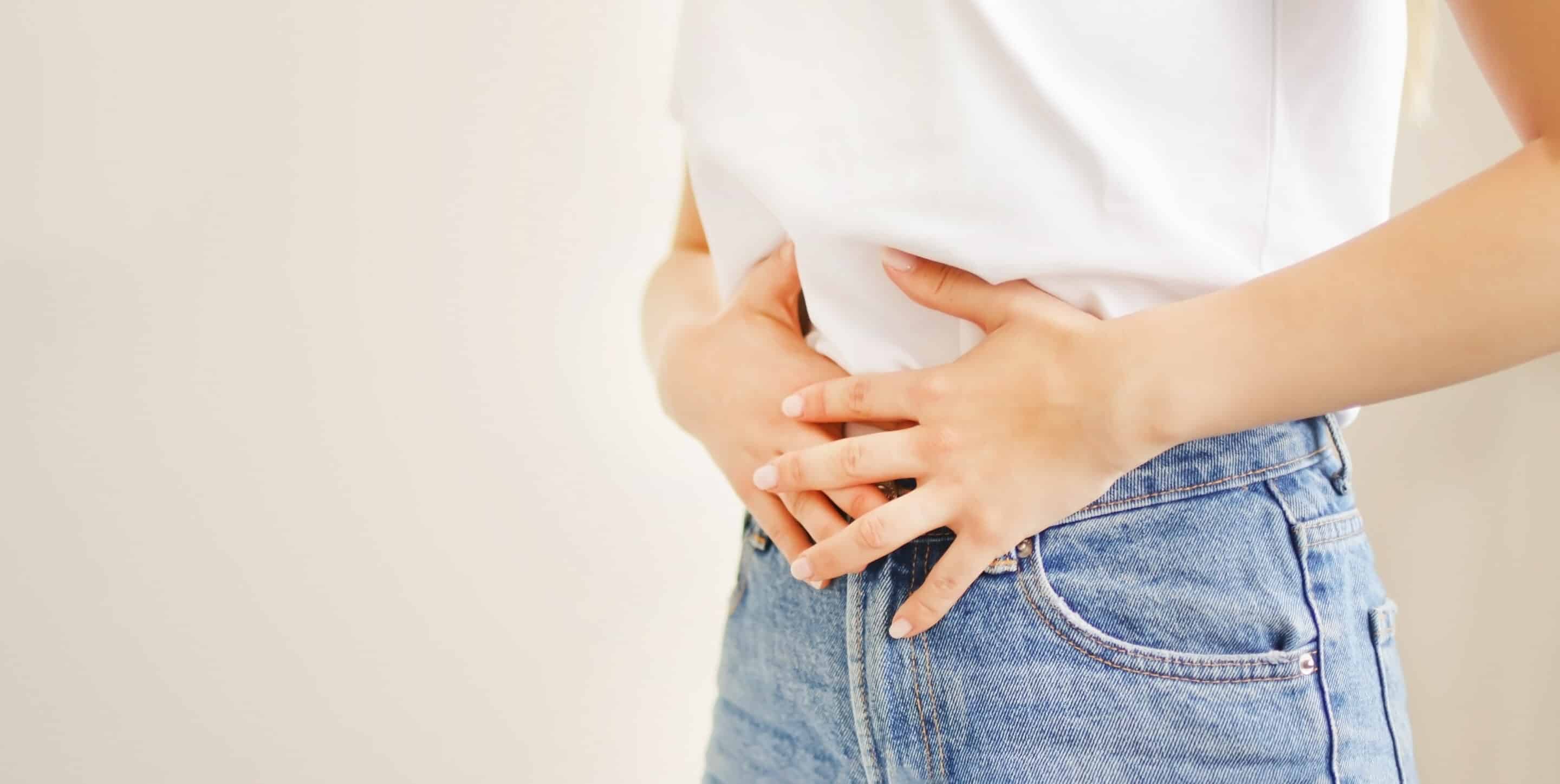 Hands holding stomach