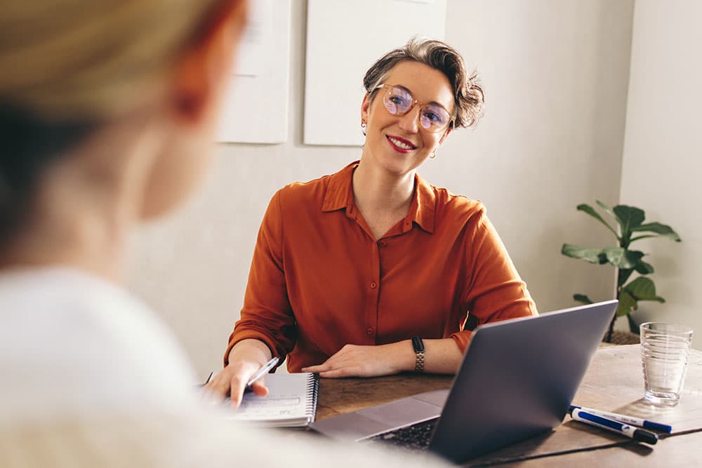 Manager supporting employee with menopause symptoms at work